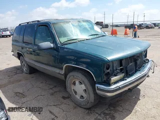 1998 GMC Yukon z VIN 1GKEK13R3WJ715863, wystawiony jako IAAI lot #42410130 z przebiegiem 154 139 mil mil oraz . Historia ofert i sprzedaży dostępna na DreamBid. Obrazek 1.