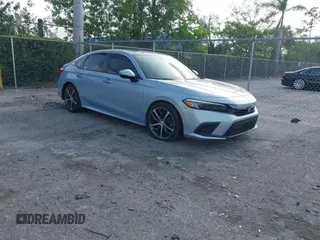 2023 Honda Civic Touring with VIN 2HGFE1F91PH305053, listed as a IAAI auction lot 42378311 with 41,576 mi miles and . Bid and sale history available at DreamBid. Image 1.