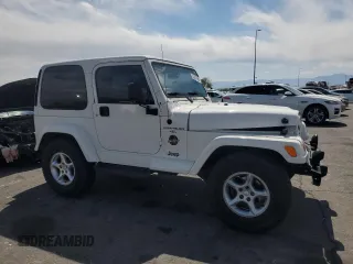 2000 Jeep Wrangler Sahara with VIN 1J4FA59S6YP790541, listed as a Copart auction lot 53837885 with 137,827 mi miles and Salvage title. Bid and sale history available at DreamBid. Image 4.