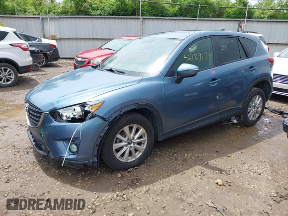 2016 Mazda CX-5 Touring z VIN JM3KE2CY3G0728968, wystawiony jako IAAI lot #42189174 z przebiegiem 145 977 mil mil oraz . Historia ofert i sprzedaży dostępna na DreamBid. Obrazek 2.