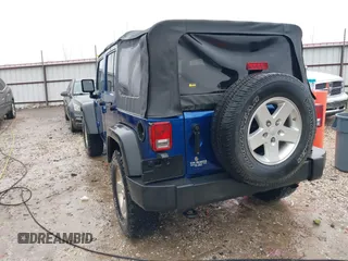 2009 Jeep Wrangler Unlimited X with VIN 1J4GA39189L787777, listed as a IAAI auction lot 41570579 with 193,163 mi miles. Bid and sale history available at carsss.com. Image 3.