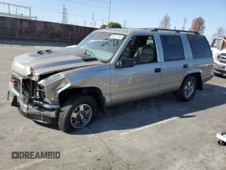 1999 GMC Yukon with VIN 1GKEC13R9XJ704929, listed as a Copart auction lot 89097295 with 87,478 mi miles and Salvage Title. Bid and sale history available at carsss.com. Image 1.