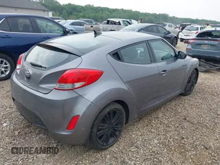 2012 Hyundai Veloster w/Gray Int z VIN KMHTC6ADXCU030284, wystawiony jako IAAI lot #42445394 z przebiegiem 156 536 mil mil oraz . Historia ofert i sprzedaży dostępna na DreamBid. Obrazek 4.