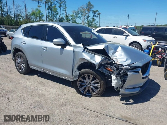 2019 Mazda CX-5 Grand Touring with VIN JM3KFADM1K1606082, listed as a IAAI auction lot 41875878 with 66,089 mi miles. Bid and sale history available at carsss.com. Image 1.