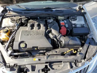 2010 Lincoln MKZ z VIN 3LNHL2GC8AR644901, wystawiony jako Copart lot #56098095 z przebiegiem 165 989 mil mil oraz Nie do naprawy • Non repairable. Historia ofert i sprzedaży dostępna na DreamBid. Obrazek 11.