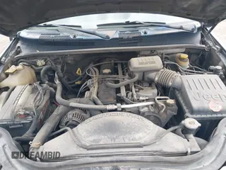 2003 Jeep Grand Cherokee Laredo with VIN 1J4GX48S03C536709, listed as a IAAI auction lot 41908946 with 240,435 mi miles. Bid and sale history available at carsss.com. Image 10.