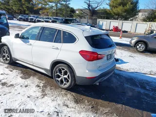2018 BMW X1 xDrive28i with VIN WBXHT3C36J5L30217, listed as a IAAI auction lot 41237775 with 60,071 mi miles. Bid and sale history available at carsss.com. Image 3.