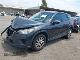 2014 Mazda CX-5 Sport with VIN JM3KE2BE0E0411377, listed as a IAAI auction lot 42143229 with 137,384 mi miles and . Bid and sale history available at carsss.com. Image 17.