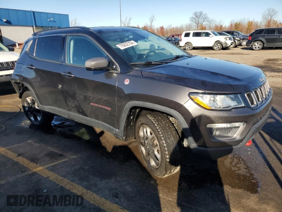 2018 Jeep Compass Trailhawk with VIN 3C4NJDDB4JT192663, listed as a Copart auction lot 79202704 with 73,665 mi miles and Salvage title. Bid and sale history available at DreamBid. Image 4.