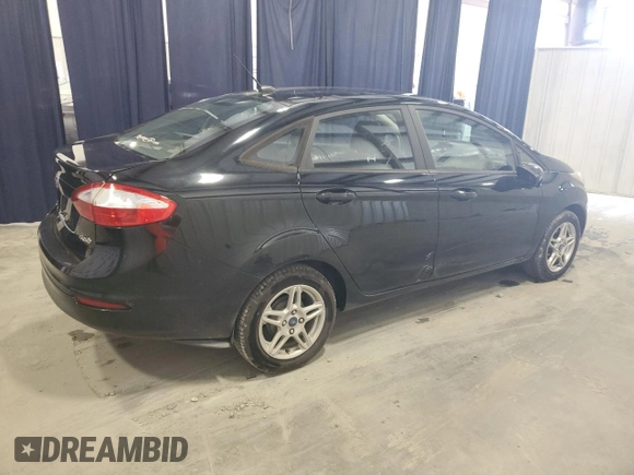 2019 Ford Fiesta SE z VIN 3FADP4BJ9KM151046, wystawiony jako Copart lot #56862255 z przebiegiem 77 002 mil mil oraz Czysty tytuł • Clean title. Historia ofert i sprzedaży dostępna na DreamBid. Obrazek 3.