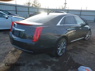2013 Cadillac XTS with VIN 2G61N5S34D9231315, listed as a IAAI auction lot 41092660 with 206,093 mi miles. Bid and sale history available at carsss.com. Image 4.