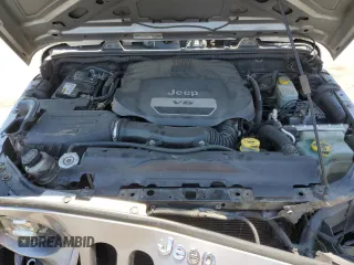 2014 Jeep Wrangler Unlimited Sport with VIN 1C4HJWDG1EL221302, listed as a Copart auction lot 63331015 with 213,912 mi miles and Salvage title. Bid and sale history available at DreamBid. Image 12.