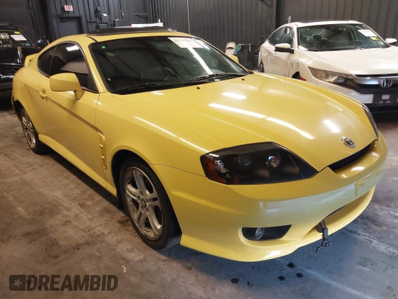 2006 Hyundai Tiburon GT z VIN KMHHN65F56U225936, wystawiony jako IAAI lot #41695280 z przebiegiem 121 110 mil mil oraz . Historia ofert i sprzedaży dostępna na DreamBid. Obrazek 1.