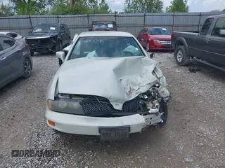 2002 Mitsubishi Diamante LS z VIN 6MMAP57P72T008216, wystawiony jako IAAI lot #42168379 z przebiegiem 154 285 mil mil oraz . Historia ofert i sprzedaży dostępna na DreamBid. Obrazek 13.