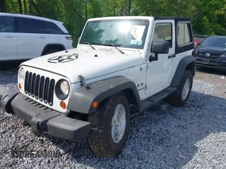 2009 Jeep Wrangler X with VIN 1J4FA24119L727658, listed as a IAAI auction lot 42372855 with 145,450 mi miles and . Bid and sale history available at DreamBid. Image 2.