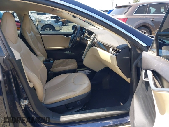 2014 Tesla Model S 60 with VIN 5YJSA1H18EFP31969, listed as a IAAI auction lot 42312485 with 90,043 mi miles and . Bid and sale history available at DreamBid. Image 5.