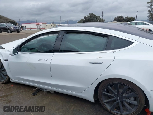 2018 Tesla Model 3 Long Range Battery with VIN 5YJ3E1EA1JF038751, listed as a IAAI auction lot 40553966 with 95,753 mi miles and . Bid and sale history available at DreamBid. Image 13.