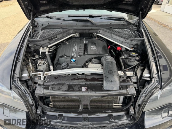 2014 BMW X6 xDrive35i z VIN 5UXFG2C57E0K41455, wystawiony jako Copart lot #58616315 z przebiegiem 162 232 mil mil oraz Czysty tytuł • Clean title. Historia ofert i sprzedaży dostępna na DreamBid. Obrazek 7.