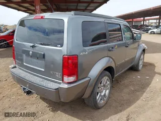 2011 Dodge Nitro Heat with VIN 1D4PU4GX2BW607498, listed as a IAAI auction lot 41685631 with 124,556 mi miles. Bid and sale history available at carsss.com. Image 4.