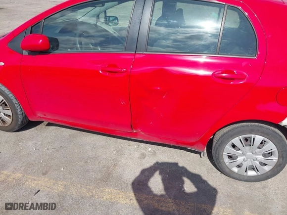 2010 Toyota Yaris with VIN JTDKT4K31A5318034, listed as a IAAI auction lot 41322096 with 114,817 mi miles. Bid and sale history available at carsss.com. Image 14.