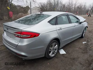 2018 Ford Fusion SE z VIN 3FA6P0LU3JR141401, wystawiony jako IAAI lot #41718444 z przebiegiem Nie podano mil oraz . Historia ofert i sprzedaży dostępna na DreamBid. Obrazek 4.
