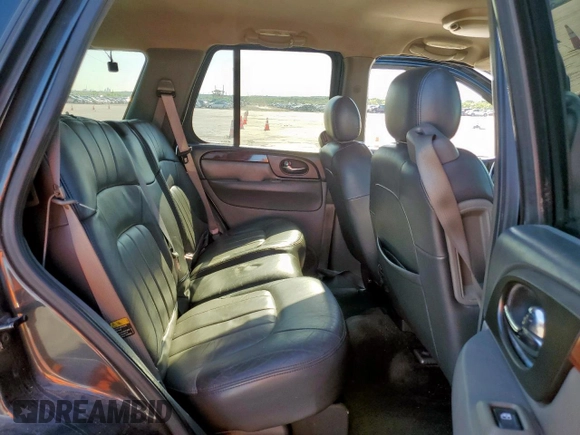 2003 GMC Envoy SLT z VIN 1GKDS13S332281271, wystawiony jako Copart lot #53685775 z przebiegiem 236 997 mil mil oraz Szkody całkowita. Historia ofert i sprzedaży dostępna na DreamBid. Obrazek 11.