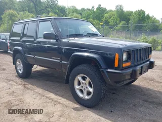 2001 Jeep Cherokee Sport z VIN 1J4FF48S01L607936, wystawiony jako IAAI lot #42453304 z przebiegiem 127 404 mil mil oraz . Historia ofert i sprzedaży dostępna na DreamBid. Obrazek 1.
