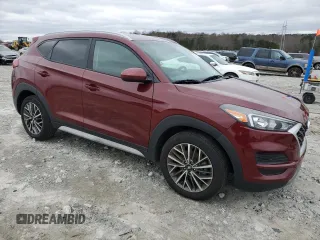 2019 Hyundai Tucson Sport with VIN KM8J33AL0KU875219, listed as a Copart auction lot 86816254 with 82,829 mi miles and Salvage Title. Bid and sale history available at carsss.com. Image 4.
