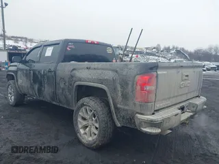 2018 GMC Sierra 1500 SLE z VIN 3GTU2MEC8JG249701, wystawiony jako IAAI lot #41556135 z przebiegiem 87 657 mil mil oraz . Historia ofert i sprzedaży dostępna na DreamBid. Obrazek 3.