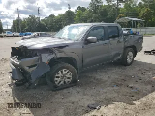 2022 Nissan Frontier Pro-4X with VIN 1N6ED1EK8NN680666, listed as a Copart auction lot 59164865 with 57,697 mi miles and Salvage title. Bid and sale history available at DreamBid. Image 1.