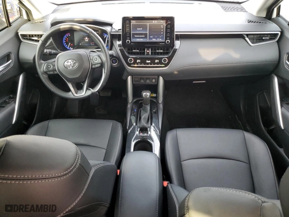 2022 Toyota Corolla Cross XLE with VIN 7MUEAAAG8NV029308, listed as a Copart auction lot 87407224 with 21,590 mi miles and Salvage Title. Bid and sale history available at carsss.com. Image 8.