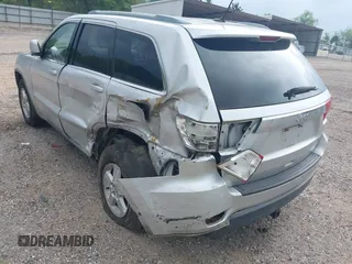 2011 Jeep Grand Cherokee Laredo with VIN 1J4RS4GGXBC564035, listed as a IAAI auction lot 41931861 with 242,291 mi miles and . Bid and sale history available at DreamBid. Image 12.