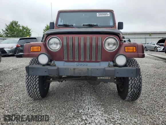 2001 Jeep Wrangler Sahara z VIN 1J4FA59SX1P305100, wystawiony jako Copart lot #58606685 z przebiegiem 76 856 mil mil oraz Czysty tytuł • Clean title. Historia ofert i sprzedaży dostępna na DreamBid. Obrazek 5.