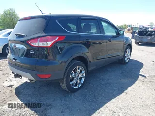 2013 Ford Escape SEL with VIN 1FMCU9H97DUA51529, listed as a IAAI auction lot 42164245 with 106,649 mi miles and . Bid and sale history available at DreamBid. Image 4.
