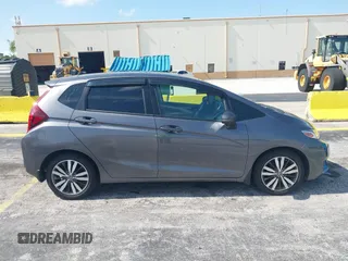 2015 Honda Fit EX-L z VIN 3HGGK5H89FM730013, wystawiony jako IAAI lot #42673309 z przebiegiem 142 660 mil mil oraz . Historia ofert i sprzedaży dostępna na DreamBid. Obrazek 13.