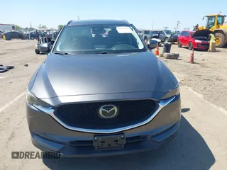 2017 Mazda CX-5 Grand Touring with VIN JM3KFADL6H0217850, listed as a IAAI auction lot 42033404 with 74,198 mi miles and . Bid and sale history available at carsss.com. Image 13.