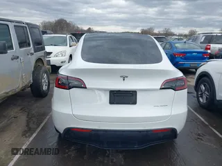 2022 Tesla Model Y Long Range with VIN 7SAYGDEE6NF461788, listed as a IAAI auction lot 41697064 with 34,034 mi miles and . Bid and sale history available at carsss.com. Image 15.