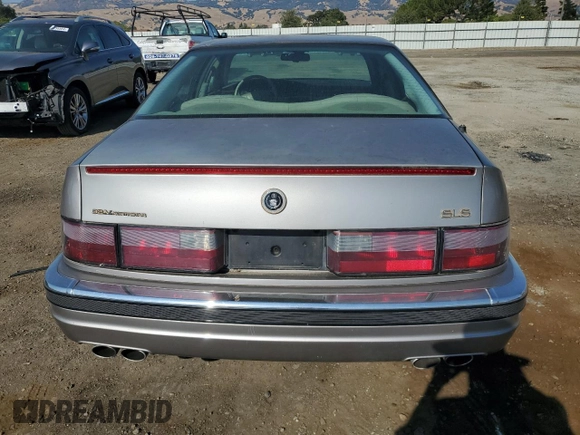 1997 Cadillac Seville Luxury SLS with VIN 1G6KS52Y0VU801906, listed as a Copart auction lot 65169364 with 191,627 mi miles and Salvage Title. Bid and sale history available at carsss.com. Image 6.