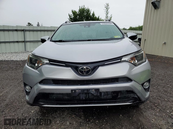 2018 Toyota RAV4 XLE with VIN JTMRFREV2JJ200677, listed as a Copart auction lot 59660535 with 82,283 mi miles and Salvage title. Bid and sale history available at DreamBid. Image 5.