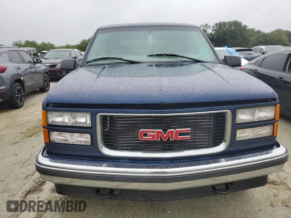 1999 GMC Yukon with VIN 1GKEK13R2XJ739931, listed as a Copart auction lot 74583734 with 115,605 mi miles and Salvage Title. Bid and sale history available at carsss.com. Image 5.