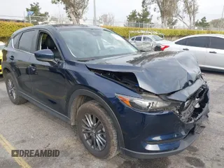 2019 Mazda CX-5 Touring with VIN JM3KFACM5K0697137, listed as a IAAI auction lot 41720253 with 50,416 mi miles. Bid and sale history available at carsss.com. Image 1.