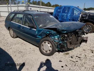 1995 Ford Escort z VIN 1FASP15J8SW308311, wystawiony jako Copart lot #77624004 z przebiegiem 345 777 mil mil oraz Szkoda całkowita • Salvage title. Historia ofert i sprzedaży dostępna na DreamBid. Obrazek 4.