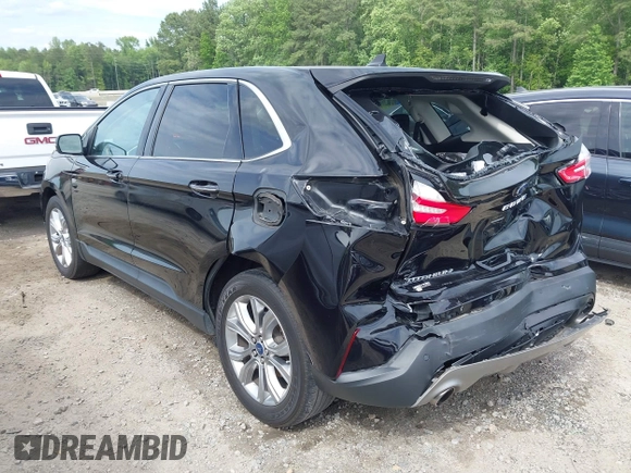 2021 Ford Edge Titanium z VIN 2FMPK3K99MBA16882, wystawiony jako IAAI lot #42214606 z przebiegiem 140 031 mil mil oraz . Historia ofert i sprzedaży dostępna na DreamBid. Obrazek 3.