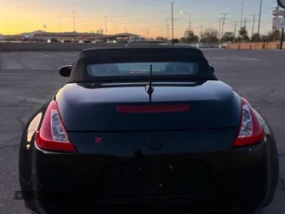 2014 Nissan 370Z Touring with VIN JN1AZ4FH1EM620177, listed as a Copart auction lot 54388235 with 107,509 mi miles and Salvage Title. Bid and sale history available at carsss.com. Image 6.