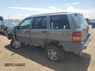 1997 Jeep Grand Cherokee Laredo z VIN 1J4GZ58S6VC636803, wystawiony jako Copart lot #59977115 z przebiegiem Nie podano mil oraz Szkoda całkowita • Salvage title. Historia ofert i sprzedaży dostępna na DreamBid. Obrazek 2.