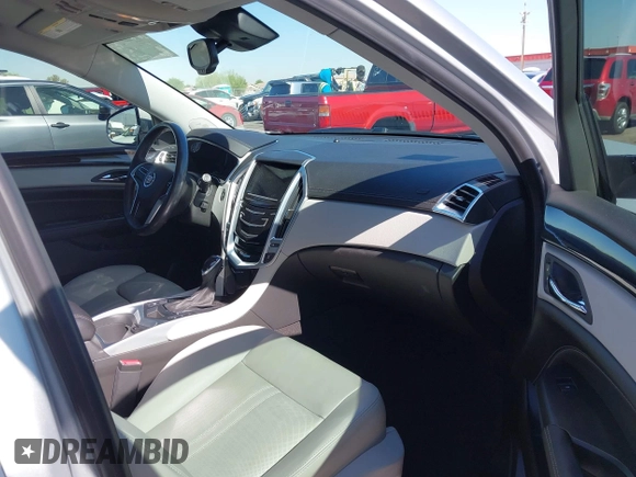 2013 Cadillac SRX Premium Collection z VIN 3GYFNEE36DS556446, wystawiony jako IAAI lot #42289824 z przebiegiem 23 988 mil mil oraz . Historia ofert i sprzedaży dostępna na DreamBid. Obrazek 5.