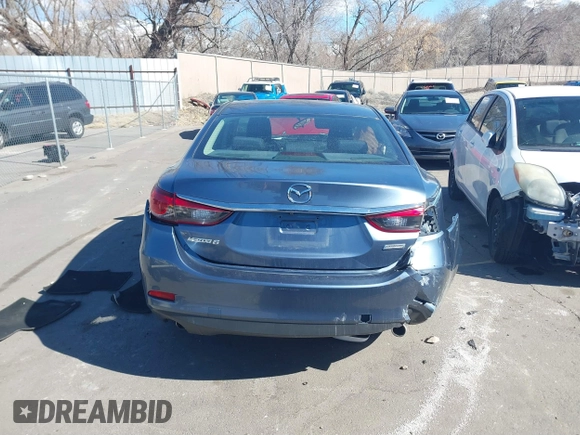 2016 Mazda 6 i Sport with VIN JM1GJ1U57G1451597, listed as a IAAI auction lot 41658184 with 142,504 mi miles and . Bid and sale history available at DreamBid. Image 16.
