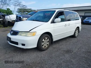2004 Honda Odyssey EX-L with VIN 5FNRL18924B064040, listed as a IAAI auction lot 41350306 with 130,803 mi miles and . Bid and sale history available at DreamBid. Image 2.