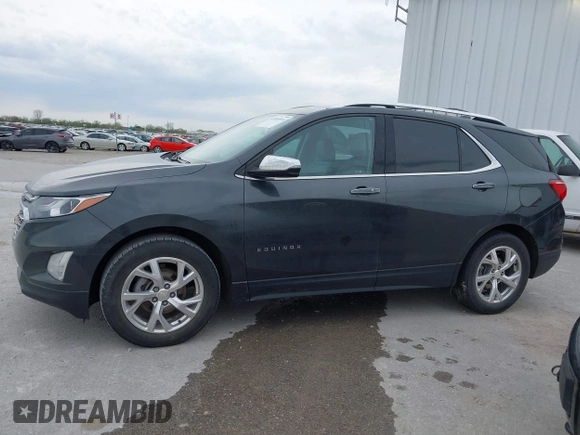 2021 Chevrolet Equinox Premier z VIN 2GNAXNEV9M6140537, wystawiony jako IAAI lot #42016514 z przebiegiem 52 237 mil mil oraz . Historia ofert i sprzedaży dostępna na DreamBid. Obrazek 14.
