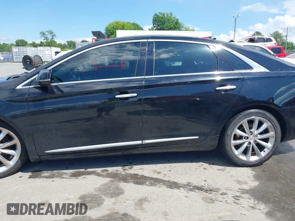 2014 Cadillac XTS Luxury z VIN 2G61N5S30E9170305, wystawiony jako IAAI lot #42223317 z przebiegiem 103 692 mil mil oraz . Historia ofert i sprzedaży dostępna na DreamBid. Obrazek 14.